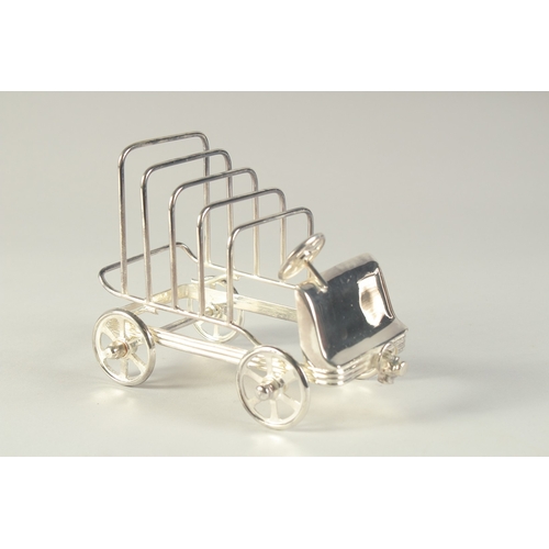 1694 - A SILVER PLATED TOAST RACK modelled as an old car. 6.5ins long.