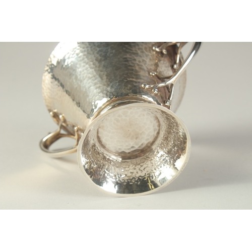 1701 - AN ART DECO HAMMERED TWO HANDLED SILVER BOWL. 4.5ins diameter, London 1904, maker: W.K.S. Weight: 8o... 