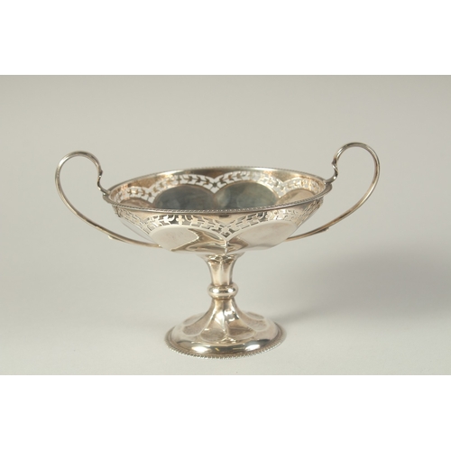 1704 - A GEORGE V CIRCULAR SILVER TWO HANDELED TAZZA. 5ins diameter, London 1919.  Weight: 6ozs.