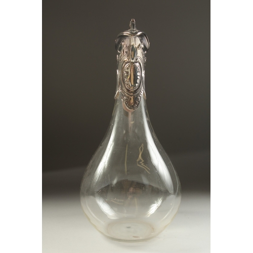 1708 - A PLAIN GLASS CLARET JUG with silver mounts and handle. London 1933.