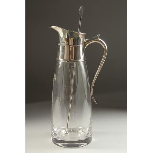 1709 - A PLAIN GLASS LEMONADE JUG with silver mount and handle. London 1979.