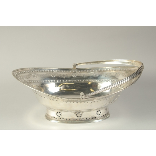 1756 - A LARGE GEORGE III SILVER OVAL CAKE BASKET with swing handles engraved with garlands. 13ins long. Lo... 