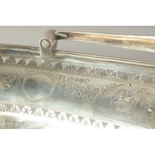 1756 - A LARGE GEORGE III SILVER OVAL CAKE BASKET with swing handles engraved with garlands. 13ins long. Lo... 