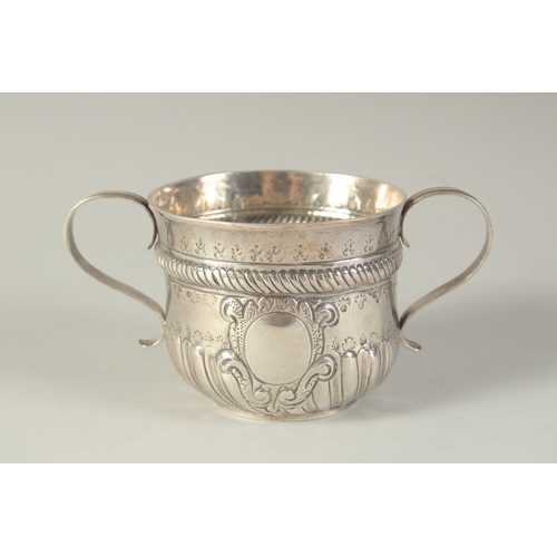 1758 - A GEORGE 1ST SILVER TWO HANDLED CIRCULAR PORRINGER. 3ins diameter, 2.5ins high. London 1718.  Maker:... 