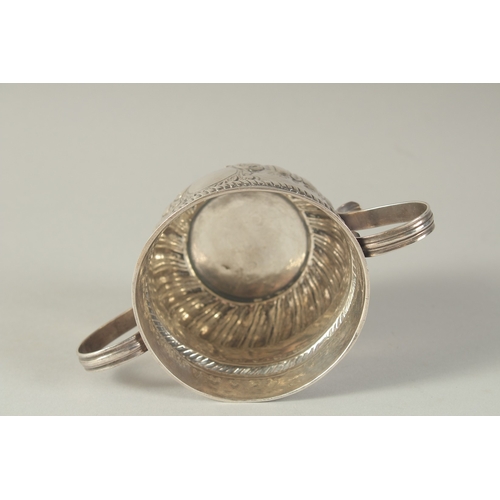 1758 - A GEORGE 1ST SILVER TWO HANDLED CIRCULAR PORRINGER. 3ins diameter, 2.5ins high. London 1718.  Maker:... 