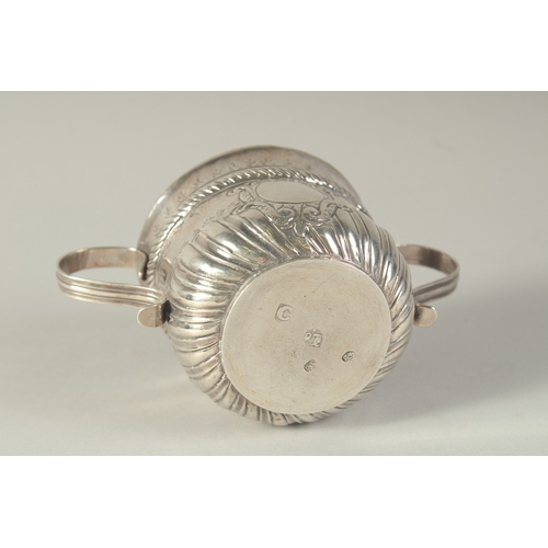 1758 - A GEORGE 1ST SILVER TWO HANDLED CIRCULAR PORRINGER. 3ins diameter, 2.5ins high. London 1718.  Maker:... 