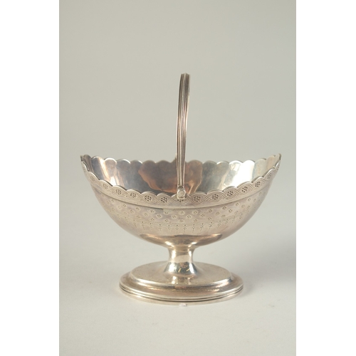 1760 - A GEORGE III SILVER BOAT SHAPE SUGAR BASKET, chased body and swing handle. London 1790.  Maker:  C. ... 