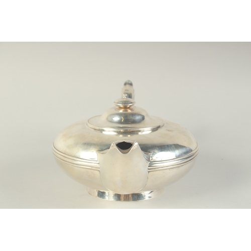 1762 - A GOOD VICTORIAN SILVER CIRCULAR TEA POT by BENJAMIN SMITH. London 1840, Weight: 28ozs.