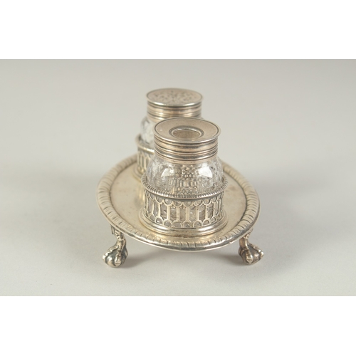 1763 - A GOOD EARLY GEORGE III TWO BOTTLED INKSTAND with pierced bottle holders, supported on four claw and... 