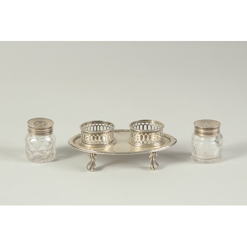 1763 - A GOOD EARLY GEORGE III TWO BOTTLED INKSTAND with pierced bottle holders, supported on four claw and... 