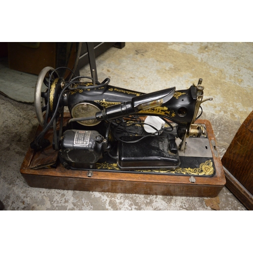 107 - A Singer sewing machine and a mirror.