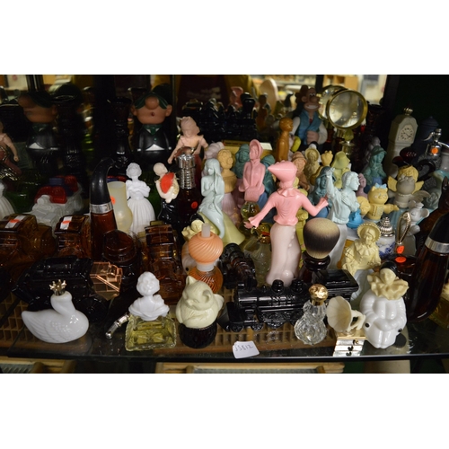 132 - A large collection of Avon novelty perfume bottles etc.