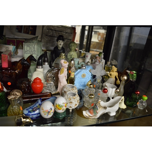 132 - A large collection of Avon novelty perfume bottles etc.