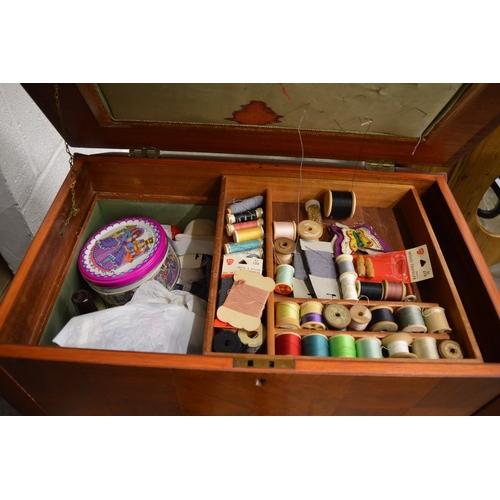 137 - Two tea trolleys and a sewing box.