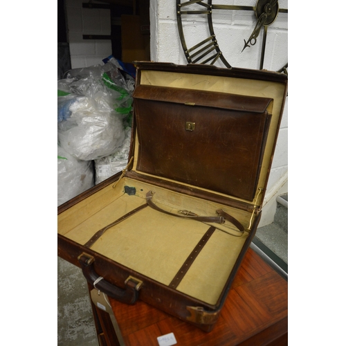 140 - A leather attache case.