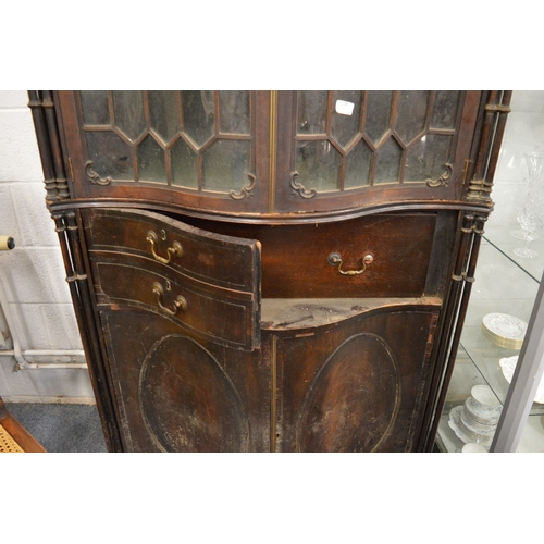 173 - An impressive Chippendale Revival mahogany serpentine fronted cupboard bookcase with secretaire draw... 