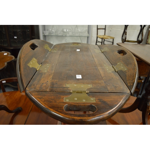 196 - A butlers style tray top table with folding flaps.