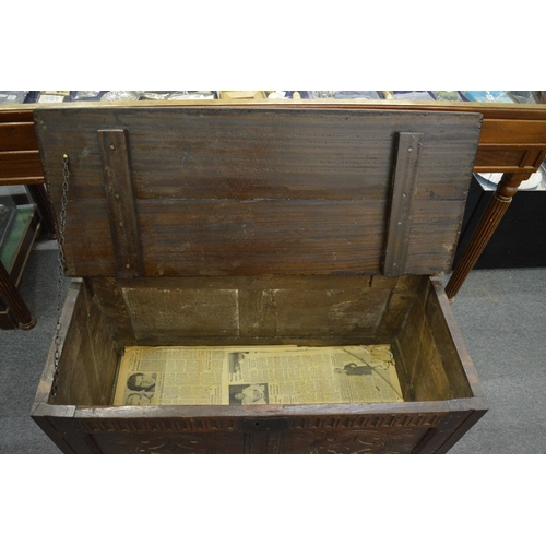 207 - An 18th century oak coffer with later top.