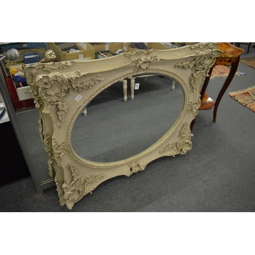 208 - A large decorative wall mirror.