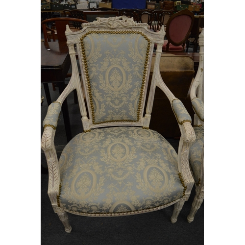 209 - A Victorian style painted and upholstered three piece salon suite comprising three seater settee and... 