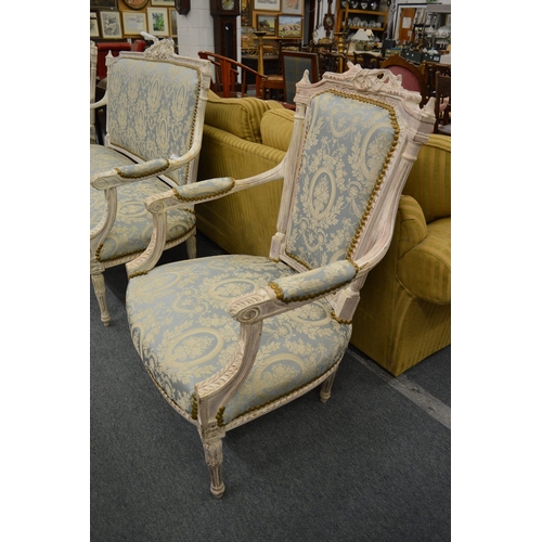 209 - A Victorian style painted and upholstered three piece salon suite comprising three seater settee and... 