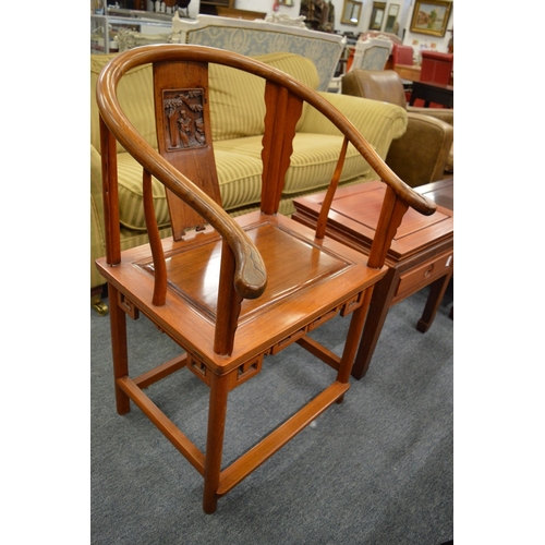 214 - A pair of Chinese hoop back armchairs.