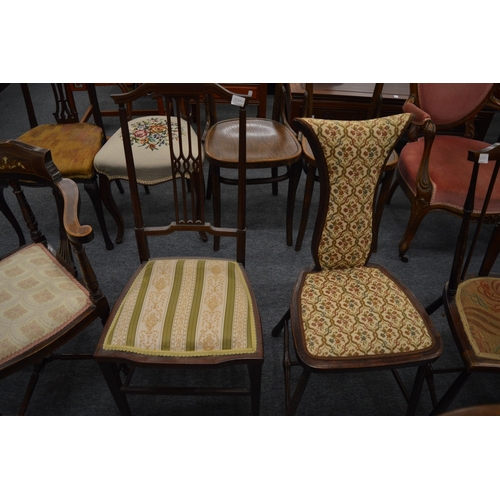 223 - An Edwardian inlaid mahogany corner armchair and four other chairs.