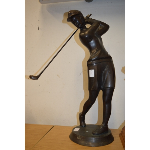 23 - Bronze figure of a golfer.