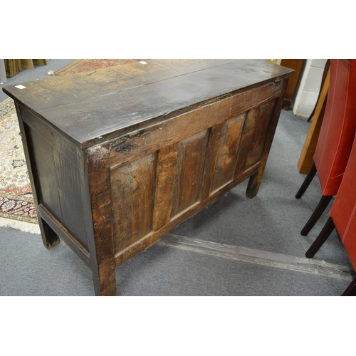 248 - A 17th century oak coffer with carved frieze and panels.