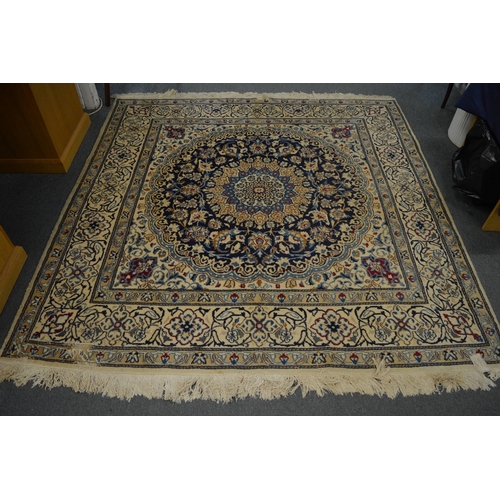 257 - A cream ground Persian design carpet with floral decoration 200cm x 200cm.