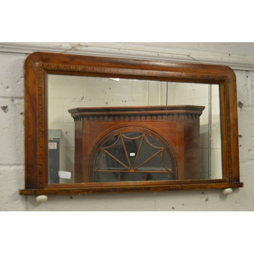 263 - A mahogany framed oval wall mirror and a Victorian walnut over-mantel mirror.