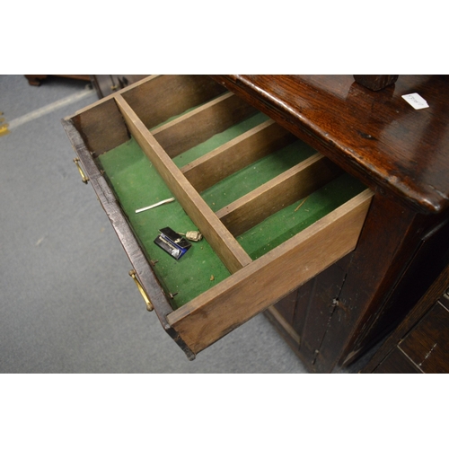 269 - An 18th century oak dresser with three frieze drawers above three panelled doors (replacement draw l... 