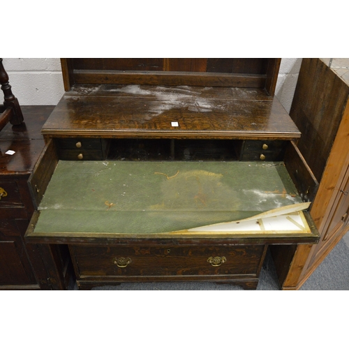 270 - A small oak dresser with secretaire style drawer.