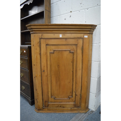 271 - A 19th century pine hanging corner cupboard.