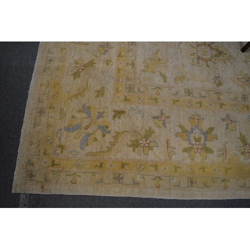 275 - An Indian carpet, cream ground with floral decoration 350cm x 270cm.