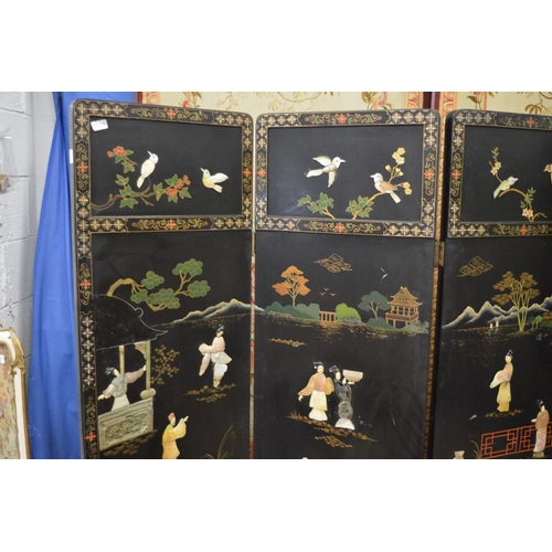 277 - A decorative Chinese four panelled dressing screen.