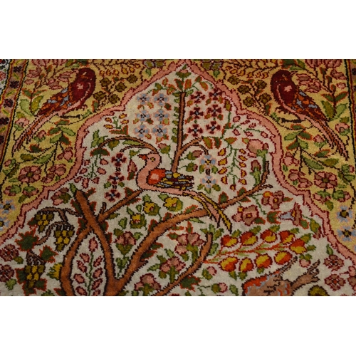 279 - A small silk Persian tree of life rug.