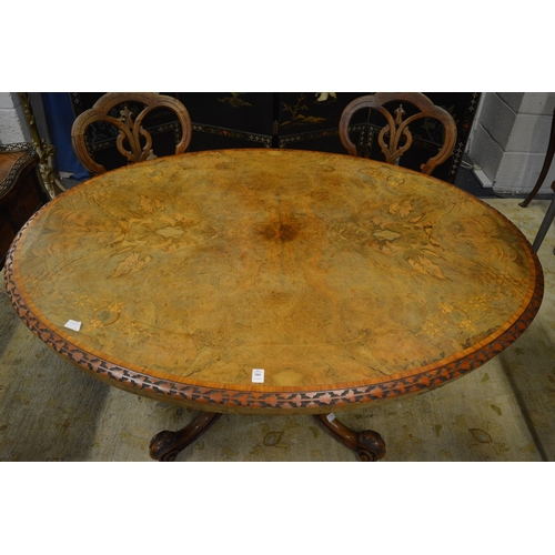 280 - A Victorian inlaid walnut oval tilt-top breakfast table.