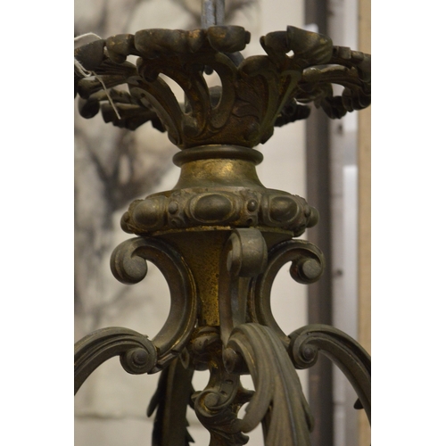 287 - A good large ornate cast bronze sixteen branch chandelier.