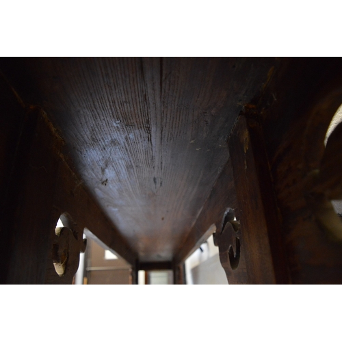 304 - A good Chinese softwood altar table with carved and pierced supports.