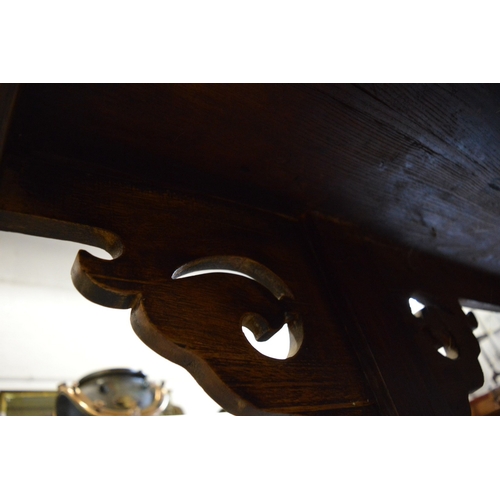 304 - A good Chinese softwood altar table with carved and pierced supports.