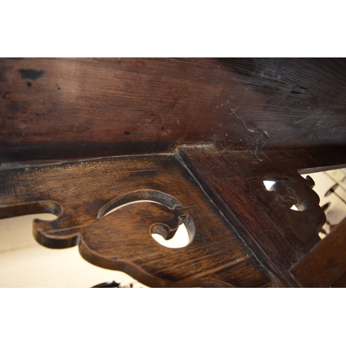 304 - A good Chinese softwood altar table with carved and pierced supports.