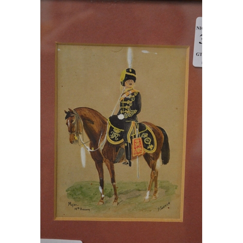 388 - A pair of small paintings of Hussars on horseback.