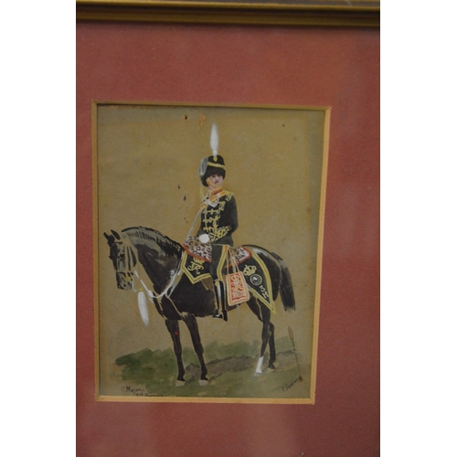 388 - A pair of small paintings of Hussars on horseback.