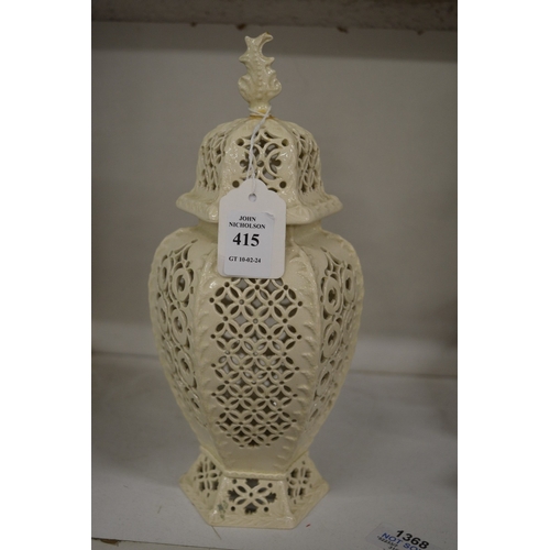 415 - A pierced cream ware vase and cover.