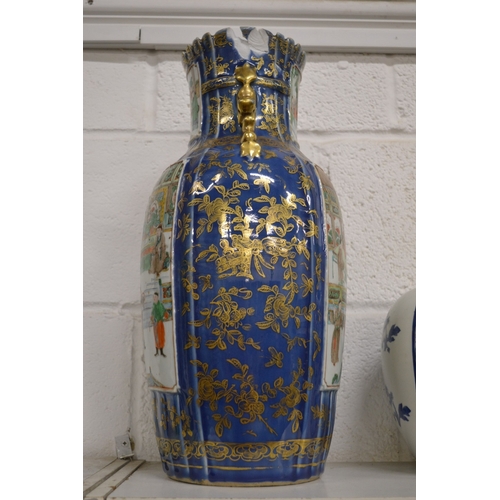 434 - A large Chinese vase, blue ground with gilded decoration painted with panels of figures in a courtya... 