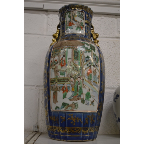 434 - A large Chinese vase, blue ground with gilded decoration painted with panels of figures in a courtya... 