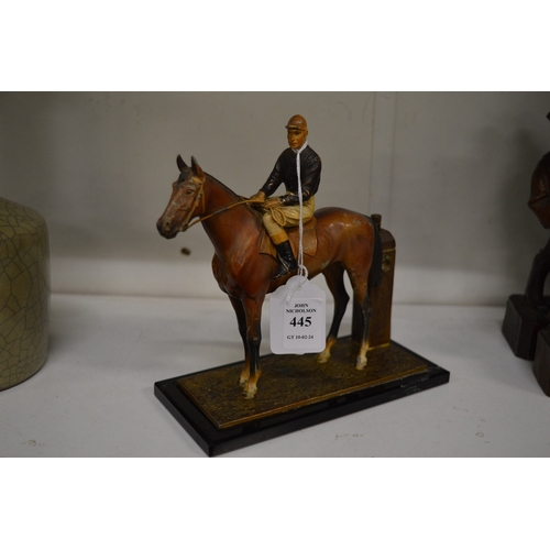 445 - A painted Spelter table lighter modelled as a horse and jockey.