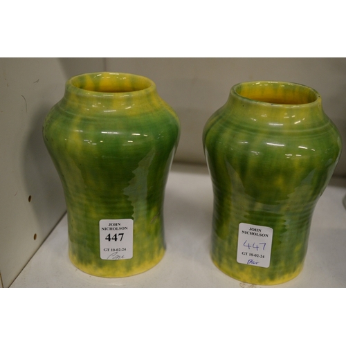 447 - Two small green glazed vases.