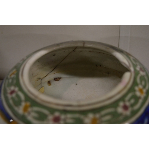 449 - An Islamic Persian Kashgar pottery bowl painted with three panels depicting busts of gentleman.